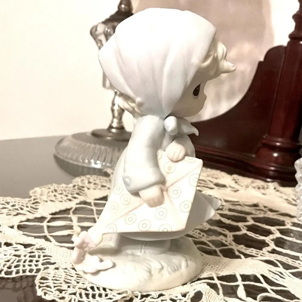 Vintage Precious Moments March Birthday Month figurine.